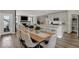 Open-concept living space with an eat-in kitchen, dining area, and fireplace, perfect for gatherings at 20147 Chad Hittle Blvd, Westfield, IN 46074