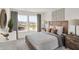 Bright bedroom features large windows with natural light, stylish decor, and a comfortable queen-sized bed at 2109 Boxwood Dr, Greenfield, IN 46140