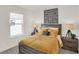 Stylish bedroom with natural light, a wooden-frame bed, and modern nightstands at 2109 Boxwood Dr, Greenfield, IN 46140