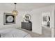 Bright bedroom with modern furnishings and an open doorway leading to another room at 2109 Boxwood Dr, Greenfield, IN 46140