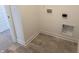Laundry room featuring tile flooring, white paint, and utility connections for washer and dryer at 2109 Boxwood Dr, Greenfield, IN 46140
