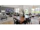 Open-concept living room and dining area featuring modern furnishings and abundant natural light at 2109 Boxwood Dr, Greenfield, IN 46140