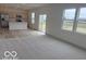 Open-concept kitchen and living area with stainless appliances, a kitchen island, and natural light at 2109 Boxwood Dr, Greenfield, IN 46140