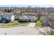Aerial view of a well-maintained ranch-style home with a manicured lawn in a quiet residential neighborhood at 2231 Reston Ln, Columbus, IN 47203