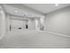 Large finished basement with neutral walls and carpet and plenty of space to relax and play at 2231 Reston Ln, Columbus, IN 47203