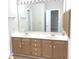 Bathroom featuring double sinks, large mirror, and vanity at 2231 Reston Ln, Columbus, IN 47203