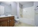 Bathroom featuring a vanity with drawers, mirror, toilet and shower tub combination at 2231 Reston Ln, Columbus, IN 47203