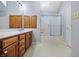 Bathroom featuring a double vanity, large mirror, and shower and tub combination at 2231 Reston Ln, Columbus, IN 47203
