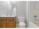 Bathroom featuring a vanity, toilet and shower tub combination at 2231 Reston Ln, Columbus, IN 47203