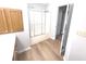 Bathroom with wood-look flooring, cabinet and shower/tub with sliding door at 2231 Reston Ln, Columbus, IN 47203