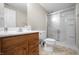 Well-maintained bathroom featuring oak cabinets and glass shower at 2231 Reston Ln, Columbus, IN 47203