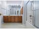 Bathroom with double vanity, large mirror, and shower tub combination at 2231 Reston Ln, Columbus, IN 47203