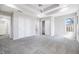 Spacious bedroom with tray ceiling, ceiling fan, neutral carpet, and closet at 2231 Reston Ln, Columbus, IN 47203