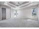 Spacious bedroom with tray ceiling, ceiling fan, natural light and neutral carpet at 2231 Reston Ln, Columbus, IN 47203