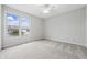 Bright bedroom features neutral walls, carpet, and large window offering natural light at 2231 Reston Ln, Columbus, IN 47203