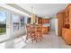 Sun-lit dining area with a table and chairs, view of backyard at 2231 Reston Ln, Columbus, IN 47203