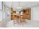 Bright dining area with table, chairs and wooden cabinets at 2231 Reston Ln, Columbus, IN 47203