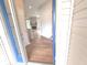 Bright entryway showcasing an open-concept design with wood-look flooring and a glimpse of the cozy living area at 2231 Reston Ln, Columbus, IN 47203