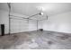 The empty two-car garage provides a clean space for parking and storage at 2231 Reston Ln, Columbus, IN 47203