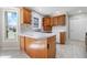 Well-lit kitchen with wooden cabinets, modern appliances, and stylish countertops at 2231 Reston Ln, Columbus, IN 47203