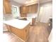Well-lit kitchen with ample cabinetry, countertops, and modern appliances at 2231 Reston Ln, Columbus, IN 47203