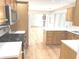 Open kitchen featuring stainless appliances, island, and view to living area at 2231 Reston Ln, Columbus, IN 47203