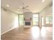 Inviting living room featuring recessed lighting, ceiling fan, fireplace and large windows with natural lighting at 2231 Reston Ln, Columbus, IN 47203