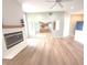 Spacious living room featuring a fireplace, open floor plan, and wood-look flooring at 2231 Reston Ln, Columbus, IN 47203