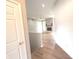 Open-concept living room featuring wood-look flooring, fireplace, and abundant natural light at 2231 Reston Ln, Columbus, IN 47203