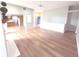 Open-concept living space featuring wood-look floors, a fireplace, and access to the kitchen at 2231 Reston Ln, Columbus, IN 47203