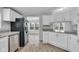 Bright kitchen featuring stainless steel appliances, granite counters, and a seamless open layout at 2305 S Rybolt Ave, Indianapolis, IN 46241