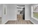 Cozy living room with hardwood floors, neutral paint, and a view into the kitchen, creating a warm and inviting space at 2305 S Rybolt Ave, Indianapolis, IN 46241