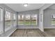 Bright sunroom with multiple windows, providing ample natural light and a view of the outdoors at 2305 S Rybolt Ave, Indianapolis, IN 46241
