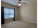 Bedroom featuring neutral walls, carpet, and a window with curtains at 2610 Big Bear Ln, Indianapolis, IN 46217