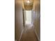 Inviting hallway with neutral carpet leading to bright, well-lit rooms, offering a welcoming path at 2610 Big Bear Ln, Indianapolis, IN 46217