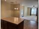View from the kitchen to the living room with light-colored walls at 2610 Big Bear Ln, Indianapolis, IN 46217