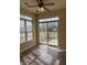 Charming sunroom with a ceiling fan, tile flooring, and sliding glass doors leading to an outdoor space at 2610 Big Bear Ln, Indianapolis, IN 46217