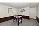 Spacious basement featuring carpet floors, paneled walls, and a foosball table perfect for entertaining at 2700 Yellowwood Ct, Columbus, IN 47203