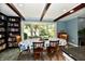 Inviting dining room with a large window and bookshelf, perfect for Gathering meals at 2700 Yellowwood Ct, Columbus, IN 47203