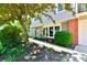 A home exterior with well maintained landscaping featuring a lovely brick accent at 2700 Yellowwood Ct, Columbus, IN 47203