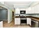 Well-designed kitchen with stainless steel appliances and light-colored walls at 2700 Yellowwood Ct, Columbus, IN 47203