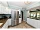 Bright kitchen with white cabinets, granite countertops and stainless steel appliances at 2700 Yellowwood Ct, Columbus, IN 47203
