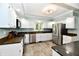 Well lit kitchen featuring granite countertops, stainless steel appliances and tile flooring at 2700 Yellowwood Ct, Columbus, IN 47203