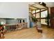 Bright living room with vaulted ceilings, brick fireplace, and natural lighting at 2700 Yellowwood Ct, Columbus, IN 47203