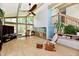 Open-concept living room featuring large windows, ceiling fan, and access to upper floor at 2700 Yellowwood Ct, Columbus, IN 47203