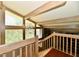 View of the staircase with wood railing and chandelier lighting at 2700 Yellowwood Ct, Columbus, IN 47203