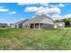 Large backyard with well-manicured lawn and neighborhood views at 2795 Lanai Ln, Greenwood, IN 46143