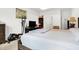 Bright bedroom features a large bed, exercise equipment, and modern decor, creating a comfortable retreat at 2795 Lanai Ln, Greenwood, IN 46143
