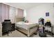 Bedroom with a decorative bed, desk, carpeted floors, with personal items adding character to the space at 2795 Lanai Ln, Greenwood, IN 46143