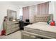 Bedroom features a stylish bed frame, dresser, carpeted floors, and a window dressed with curtains at 2795 Lanai Ln, Greenwood, IN 46143